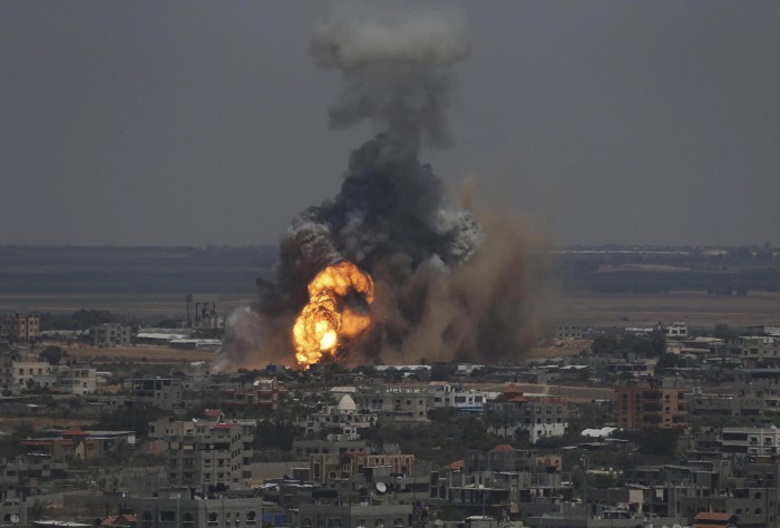Smoke and flames are seen following what police said was an Israeli air strike in Rafah in Gaza Strip