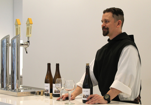 Trappist brother prepares beer taste test for fellow monks and lay workers at brewery in Spencer, Mass.