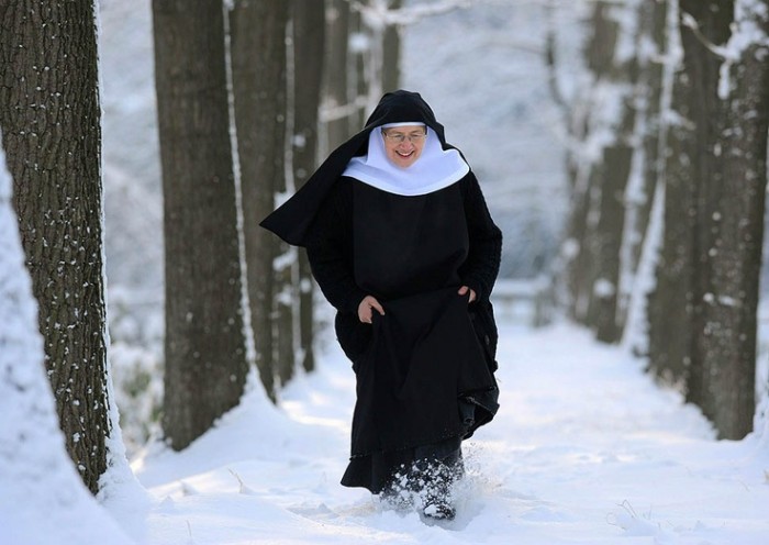 Sister Monica of the Benedictine abbey of the castle Dinklage, northwestern Germany walks through the snow on December 21, 2010. The snow chaos in Europe has upset the plans of thousands of travelers as ongoing snowfall is paralising all kinds of transport in Germany.  AFP PHOTO / INGO WAGNER  GERMANY OUT (Photo credit should read INGO WAGNER/AFP/Getty Images)