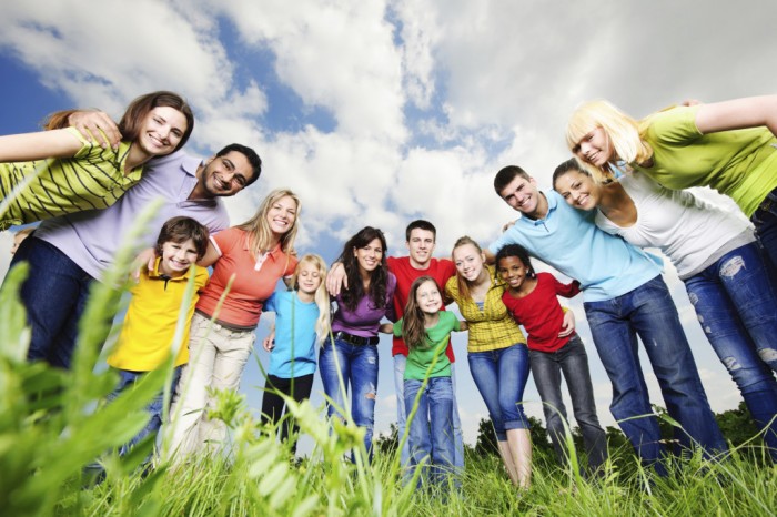 Large embraced young group of people are standing in the nature and looking at the camera.  [url=http://www.istockphoto.com/search/lightbox/9786738][img]http://img830.imageshack.us/img830/1561/groupsk.jpg[/img][/url]